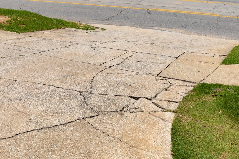large cracks in concrete driveway